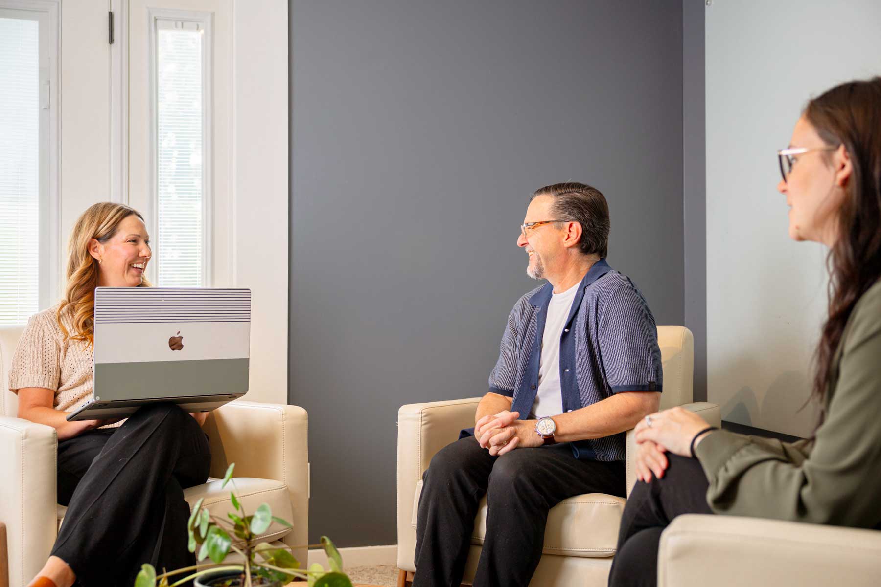 accountant meeting with clients in lobby