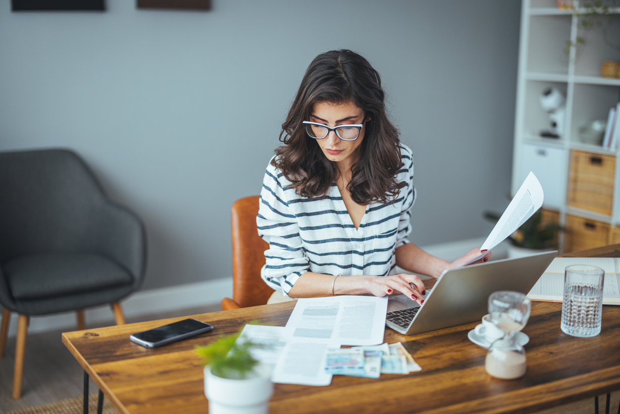 Controller preparing monthly financial reports at a desk