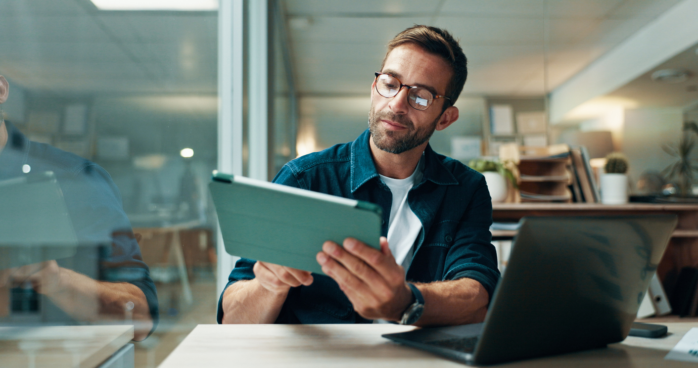 Accountant reviewing financial reports on an iPad